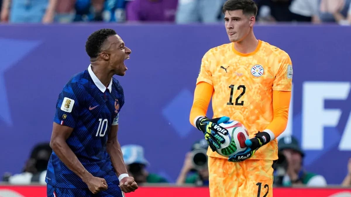 French player celebrating while goalkeeper holds ball