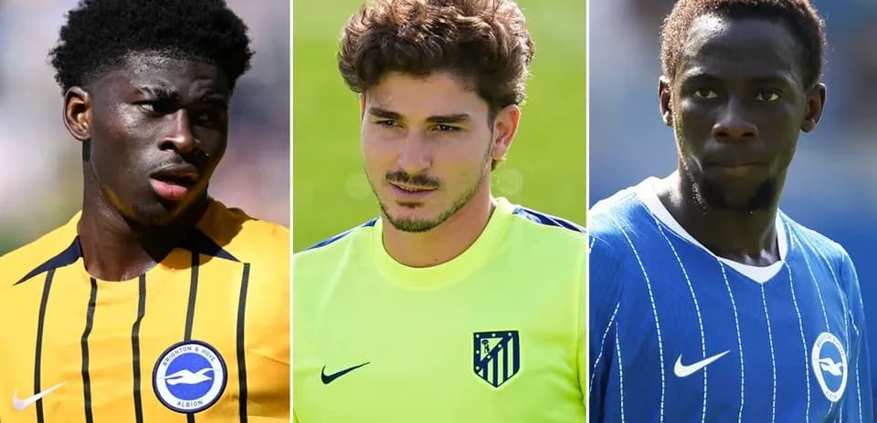 Three football players in club jerseys during training