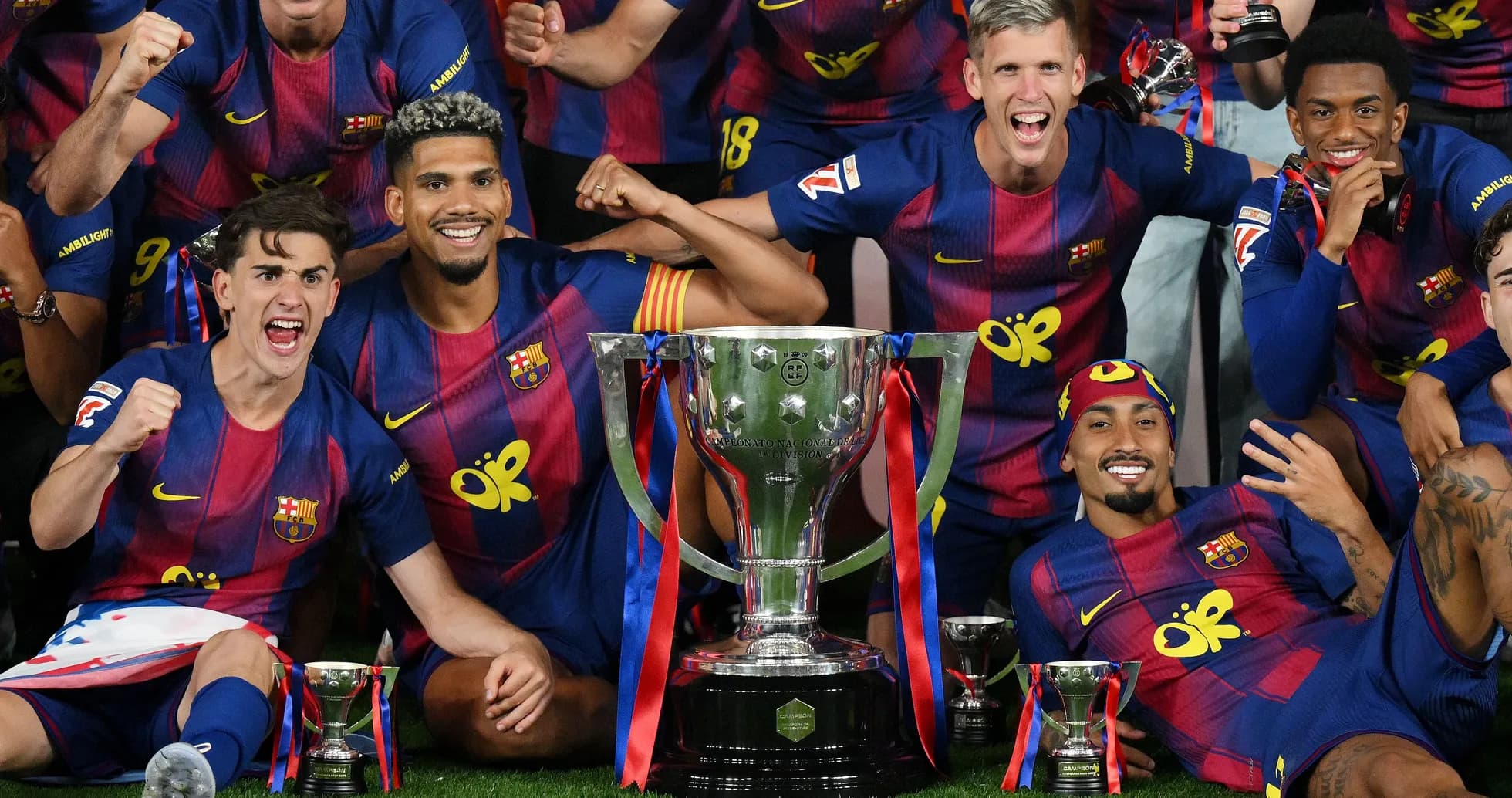 Barcelona players celebrating with trophy after victory