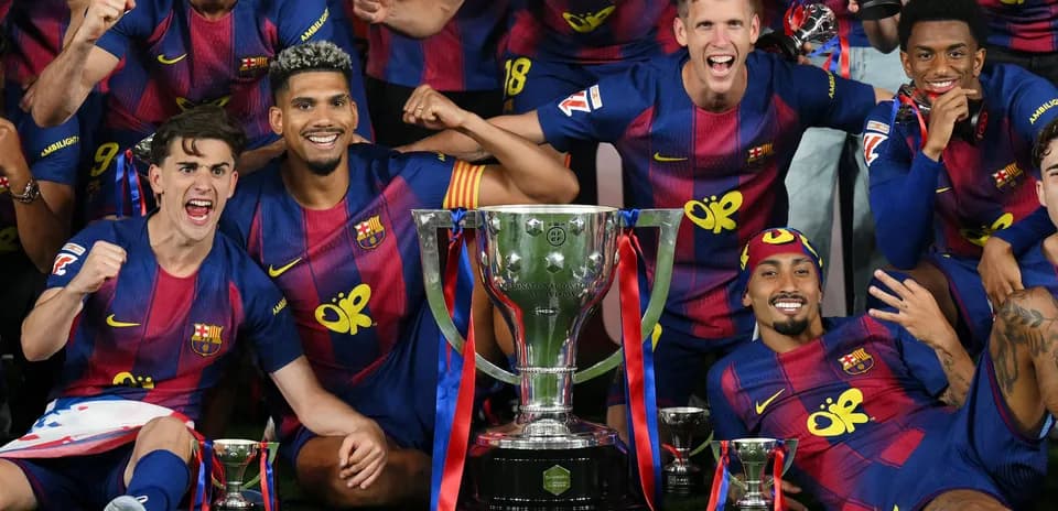 Barcelona players celebrating with trophy after victory