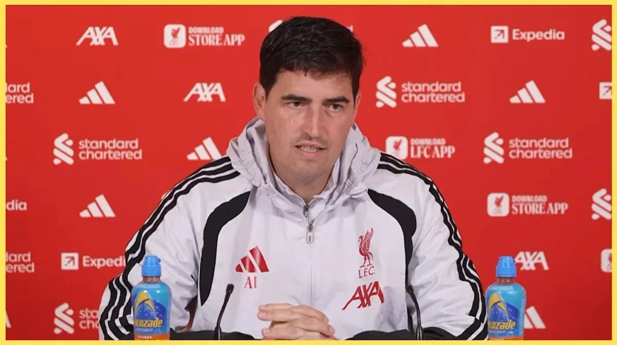 Manager speaking at Liverpool press conference backdrop