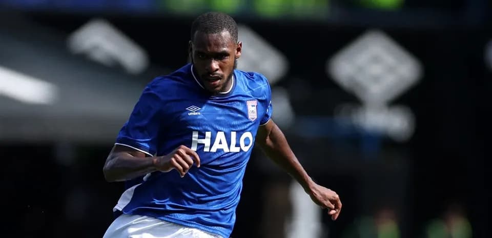 Player running in blue jersey during match