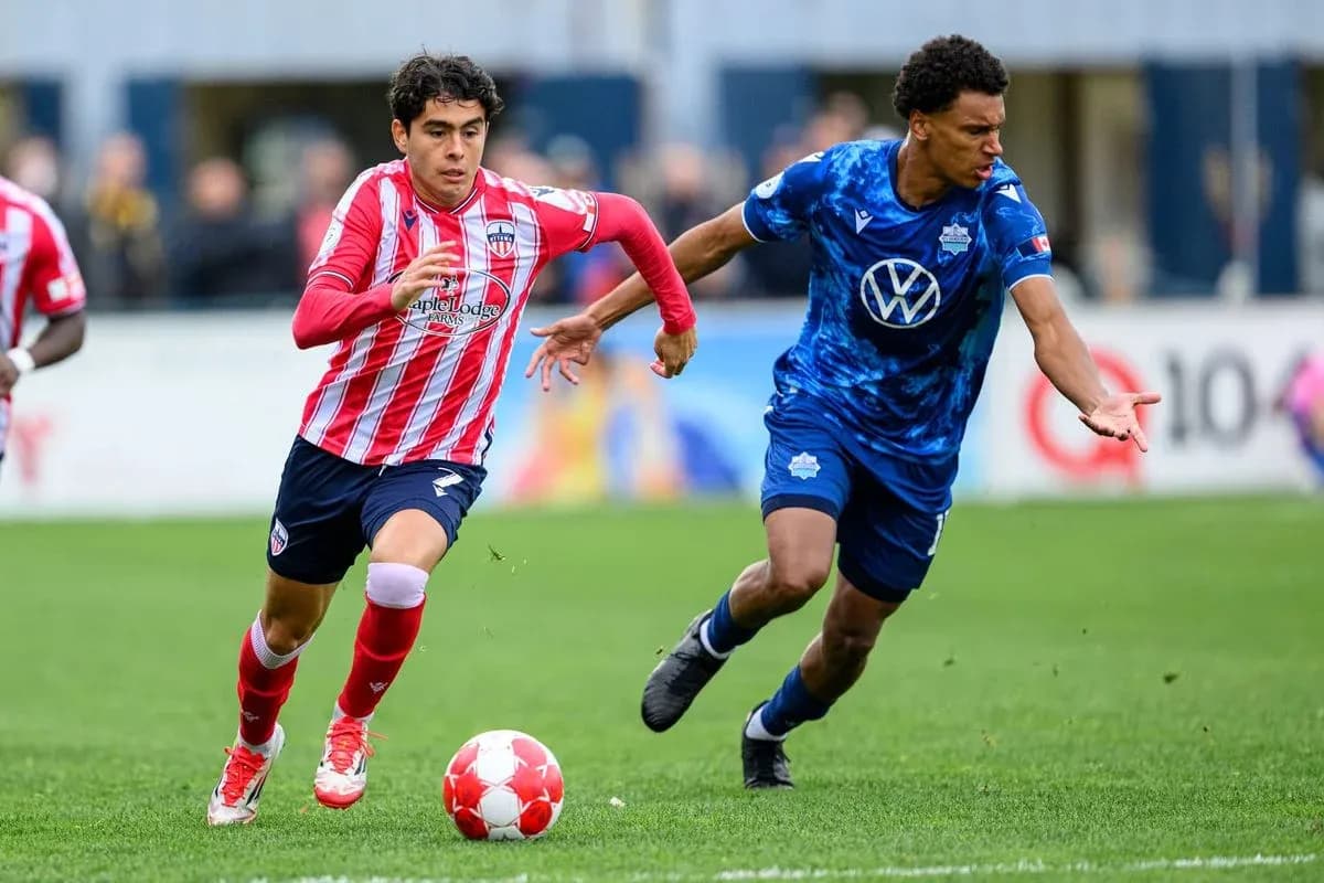 Players competing for the ball during match