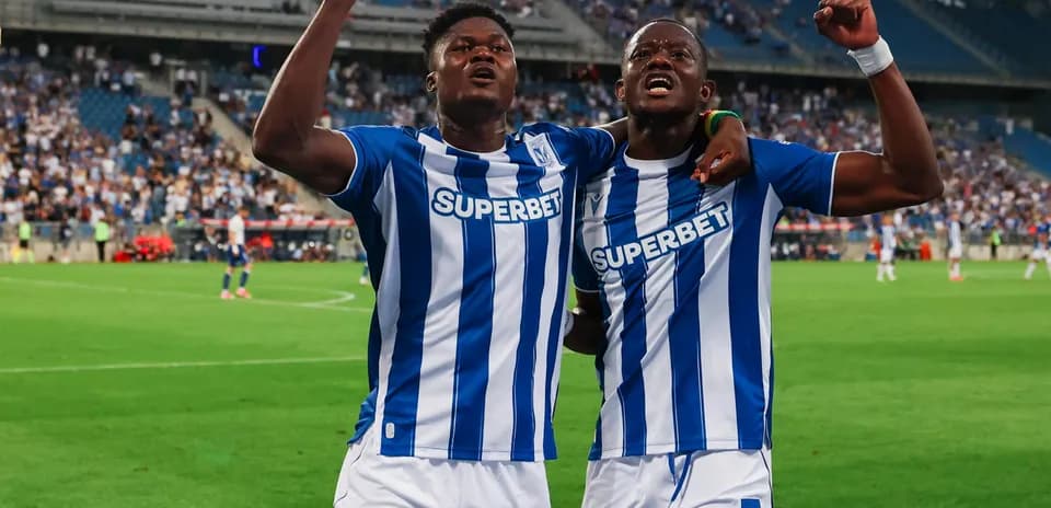 Two players celebrating after scoring a goal
