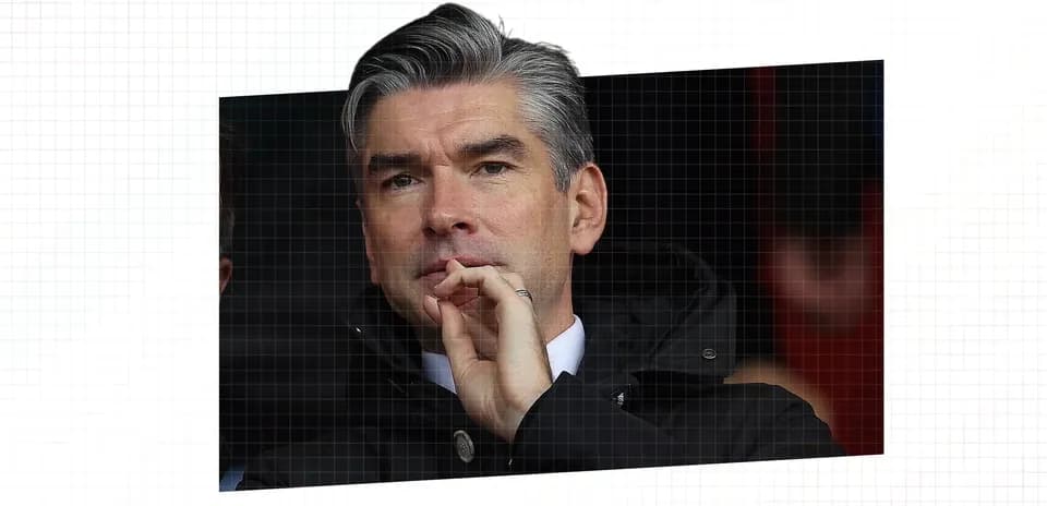 Man observing match from the stands with thoughtful expression