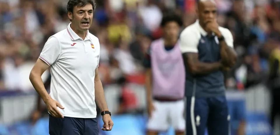 Coach giving instructions on the sidelines during match