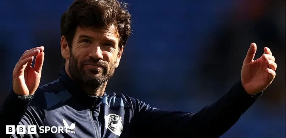 Manager gesturing during a match warm-up session