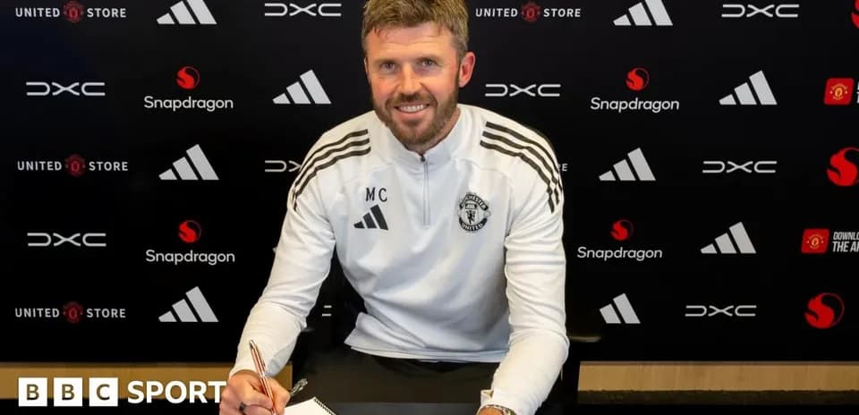 Coach signing contract at Manchester United press event
