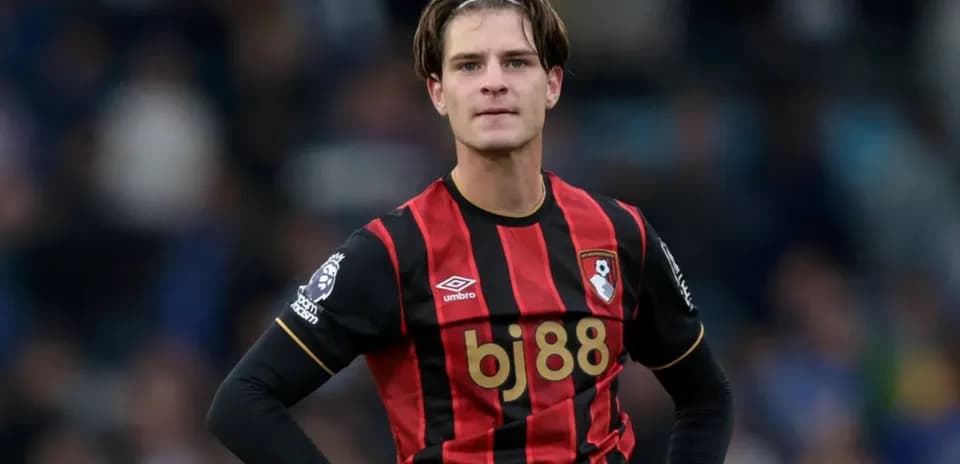 Bournemouth player in red and black jersey during match