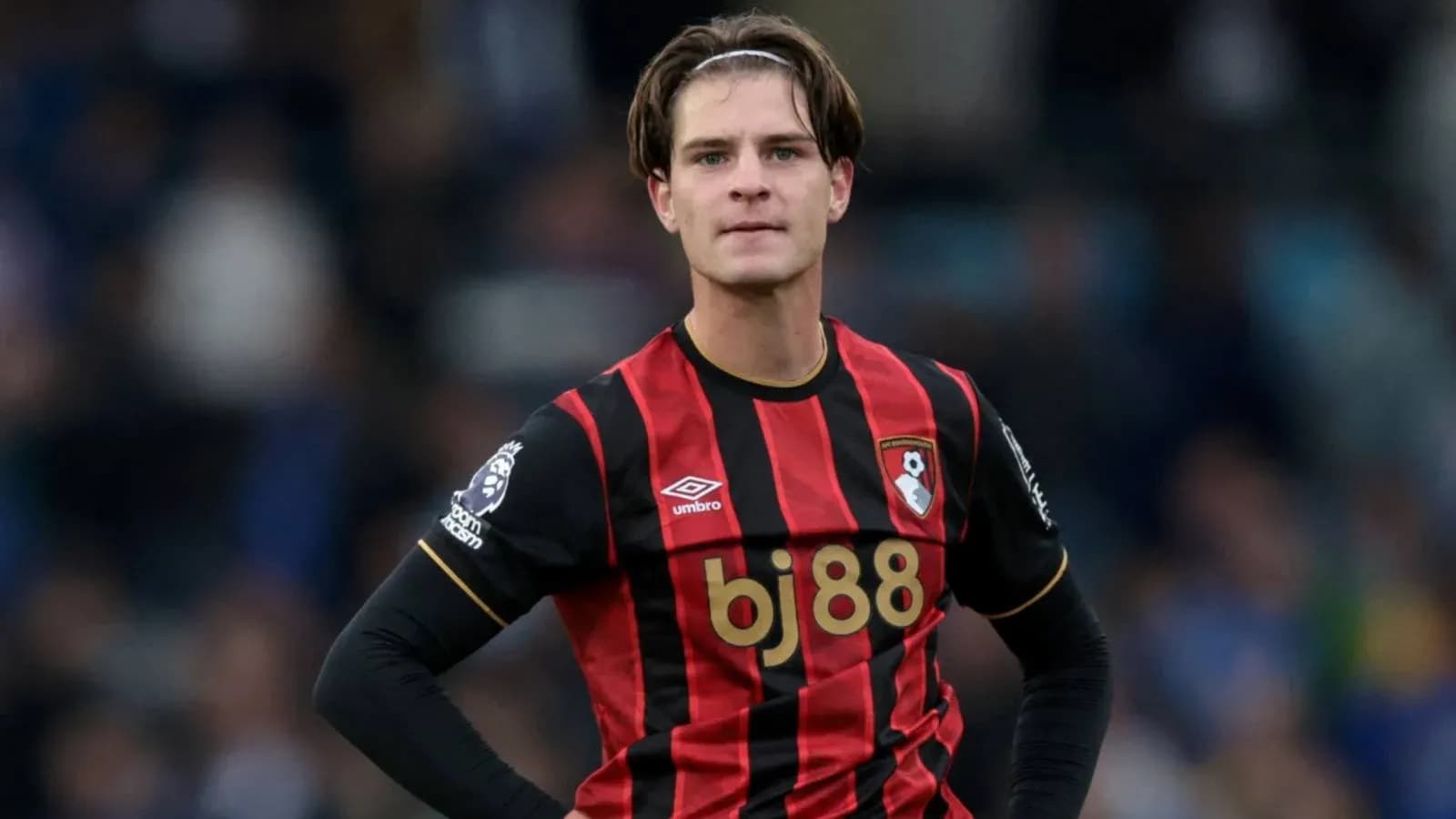 Bournemouth player in red and black jersey during match