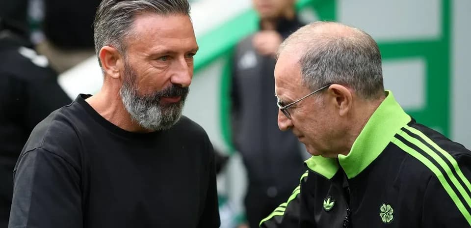 Two coaches engaging in conversation before match
