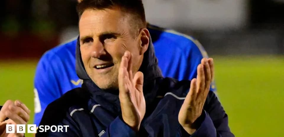 Coach applauding during a team celebration