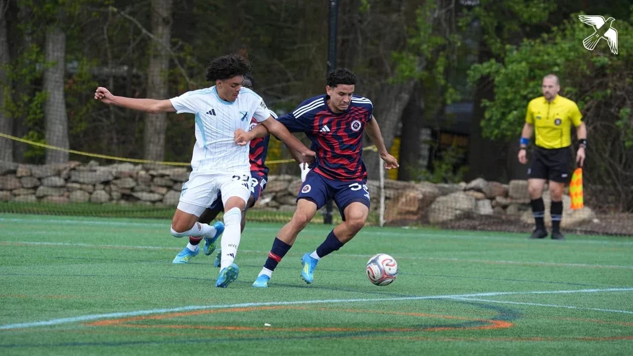 Players competing for the ball during match