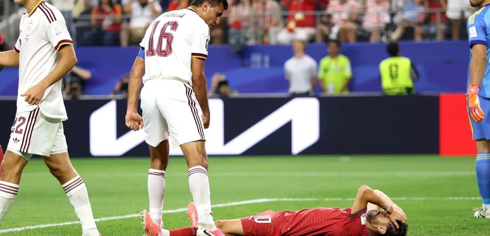 Player lying on the ground after a tackle
