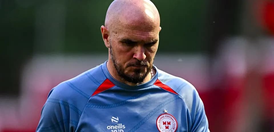 Player walking off the pitch after training session