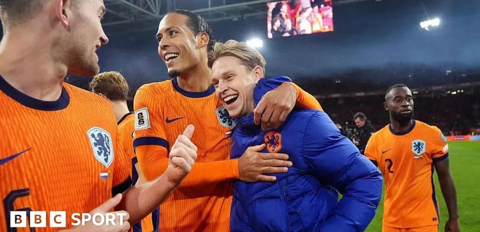 Players celebrating after a match in orange uniforms