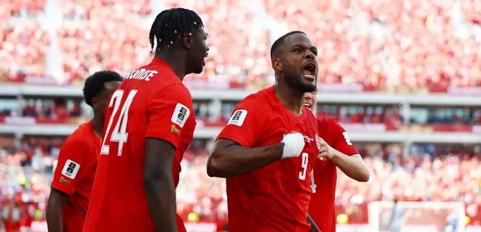 Canadian players celebrating during World Cup qualifying match