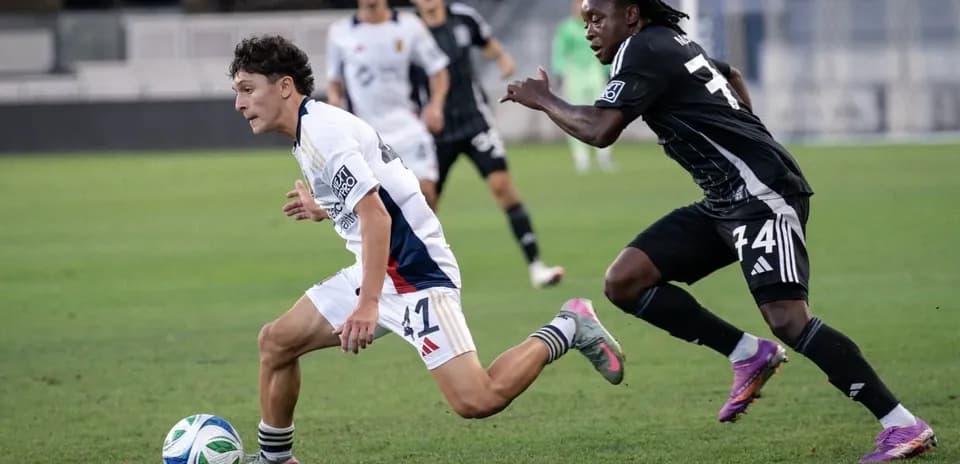Player dribbling the ball during match action