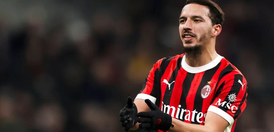 Player in AC Milan jersey gesturing during match