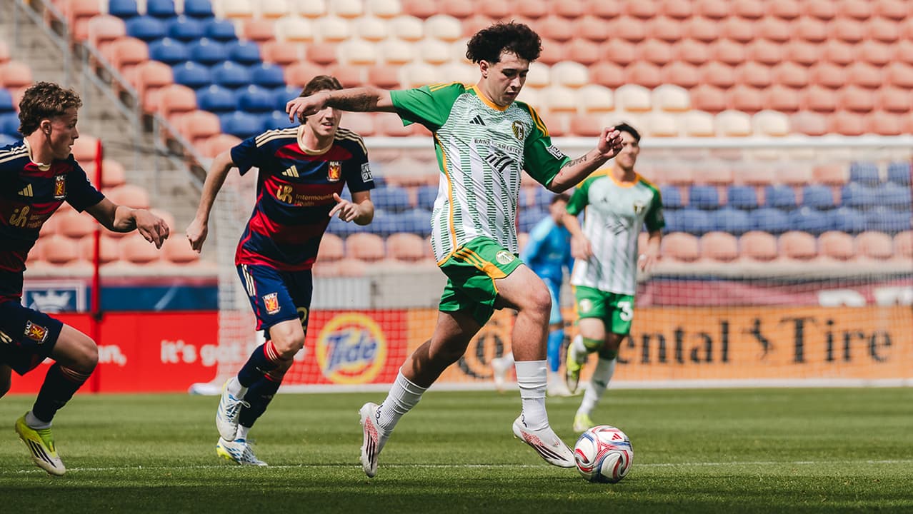 Player dribbling the ball in MLS Next Pro match