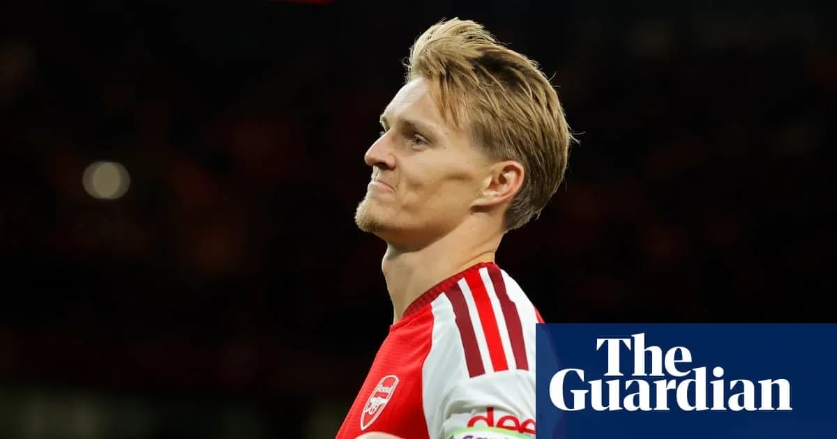 Player in Arsenal kit during match action