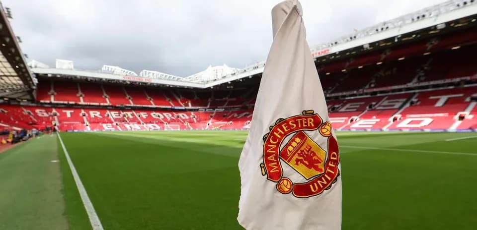 Corner flag with Manchester United logo at Old Trafford