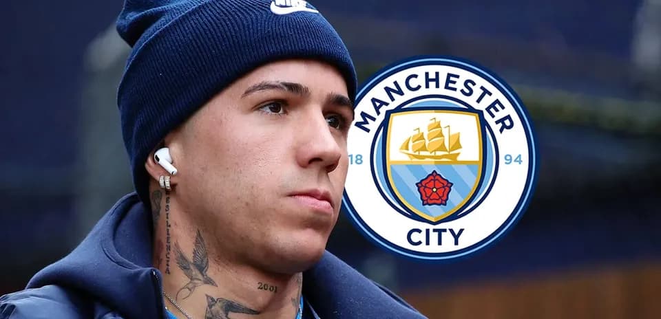 Player wearing headphones next to Manchester City logo