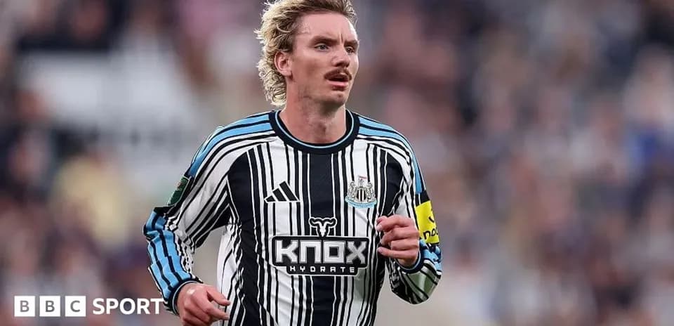 Newcastle player running on the pitch during match