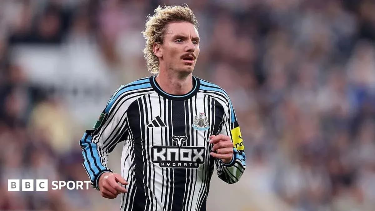 Newcastle player running on the pitch during match