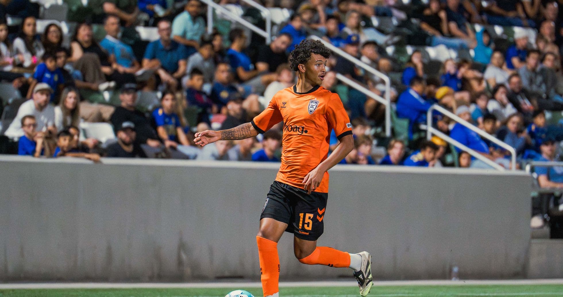 Player in orange jersey during USL League One match