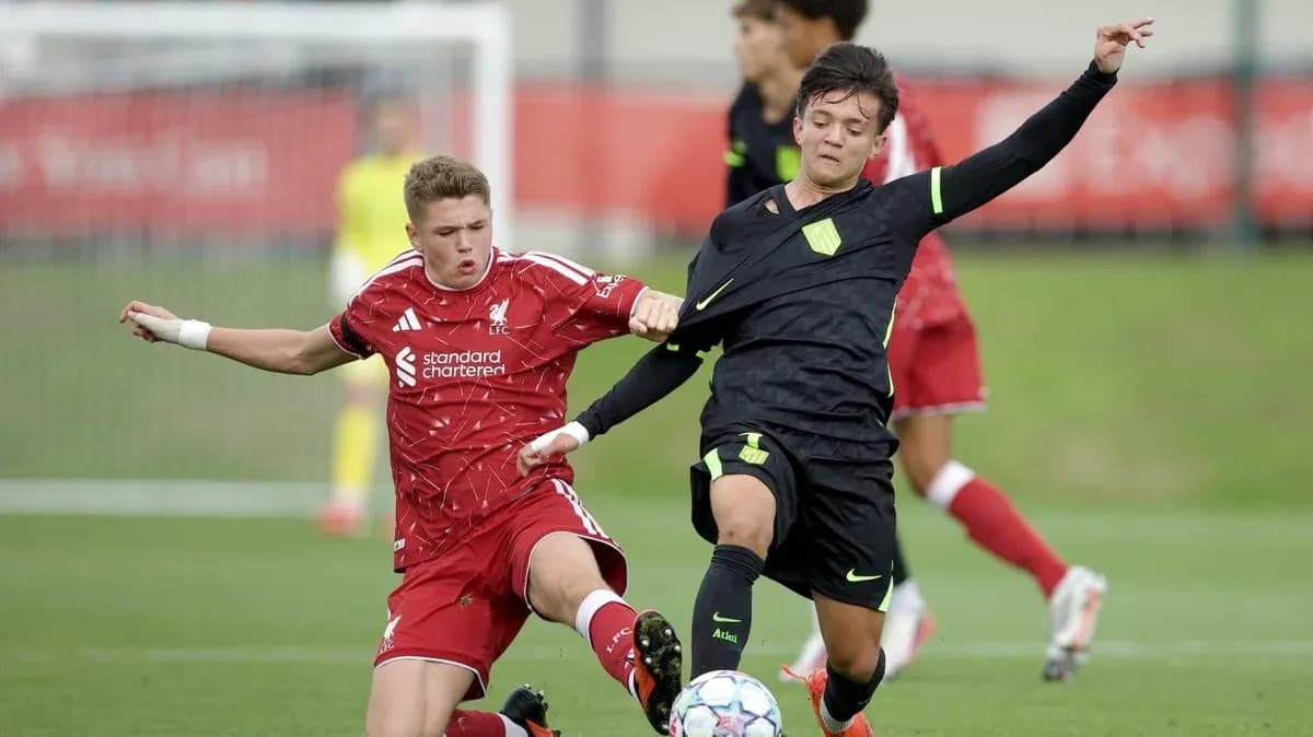 Two youth players contesting for the ball in match