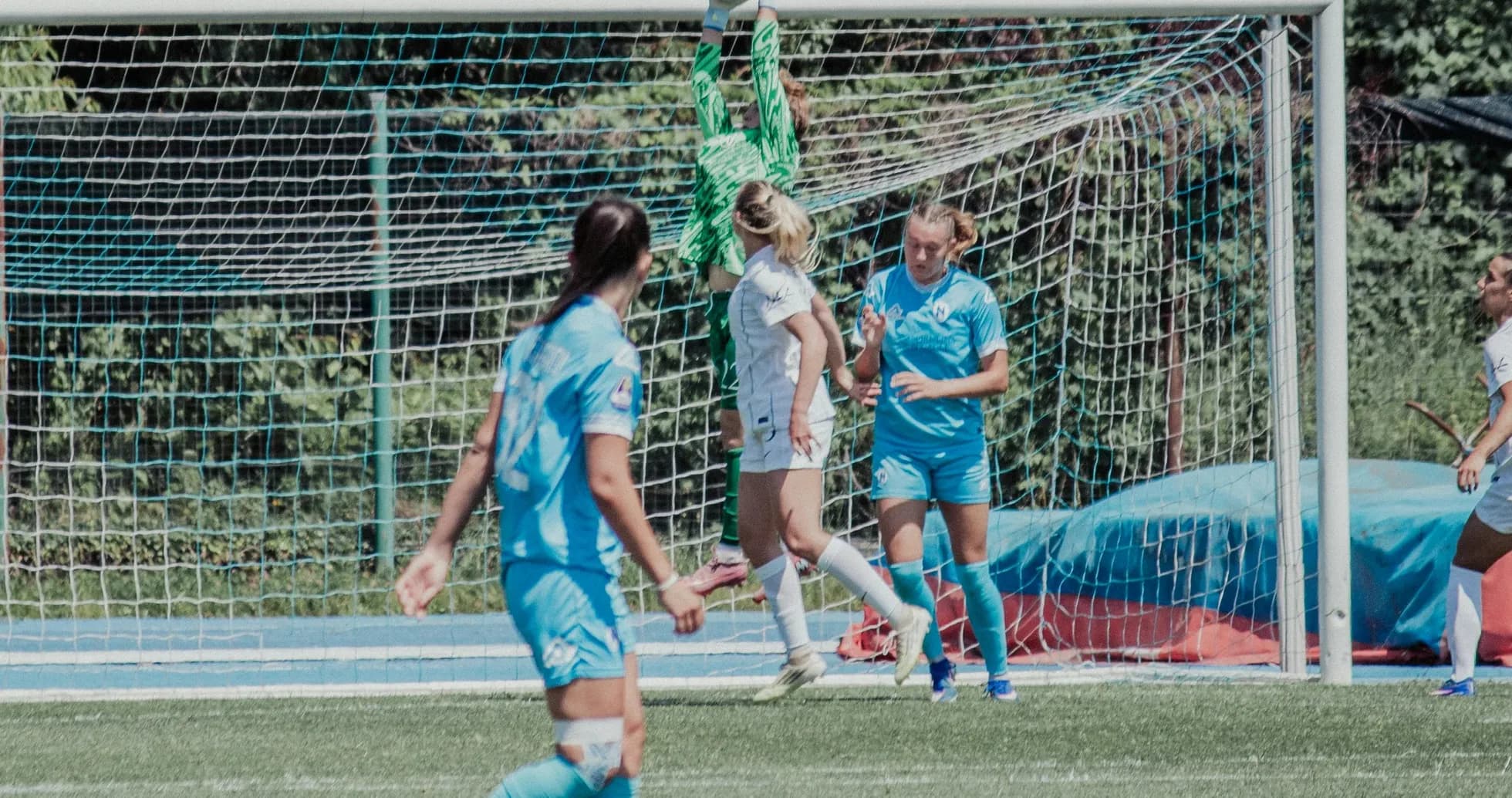 Goalkeeper catching the ball during match action