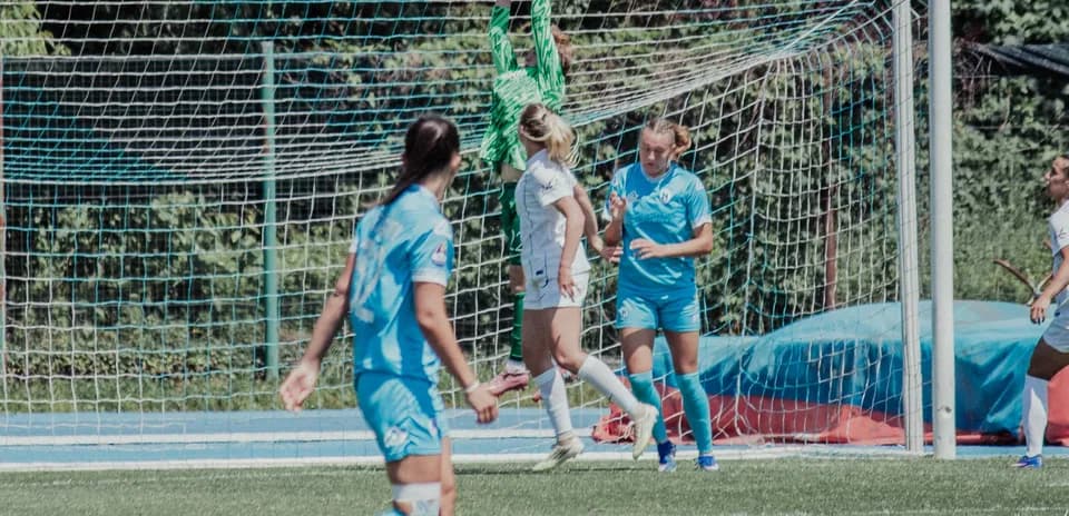 Goalkeeper catching the ball during match action