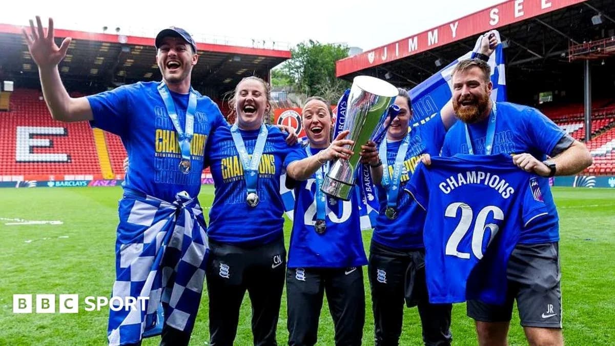 Celebrating team members holding trophy and banners
