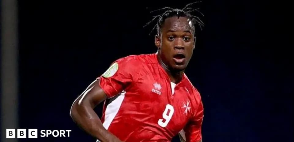 Player in red jersey during soccer match action