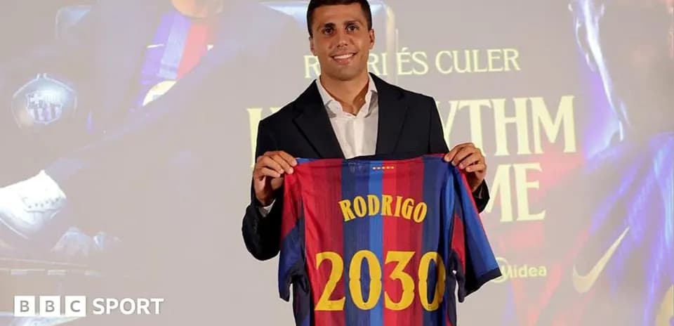Player holding Barcelona jersey with name and number