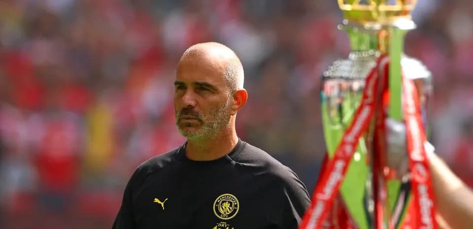Coach observing trophy presentation during match