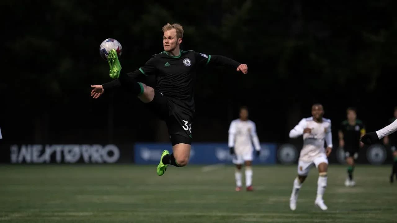 Player kicking ball during Tacoma Defiance match