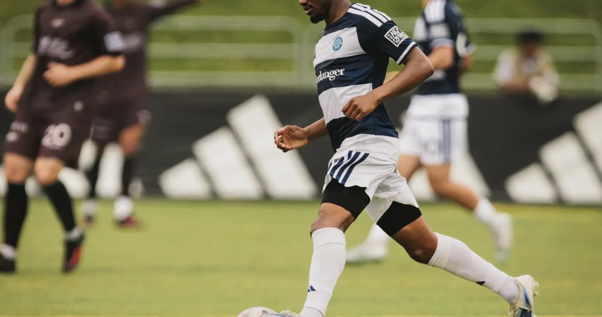 Player dribbling ball during Carolina Core match