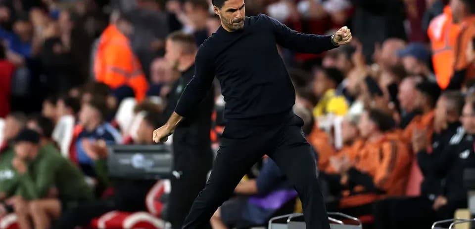 Coach celebrating during a match from the sidelines