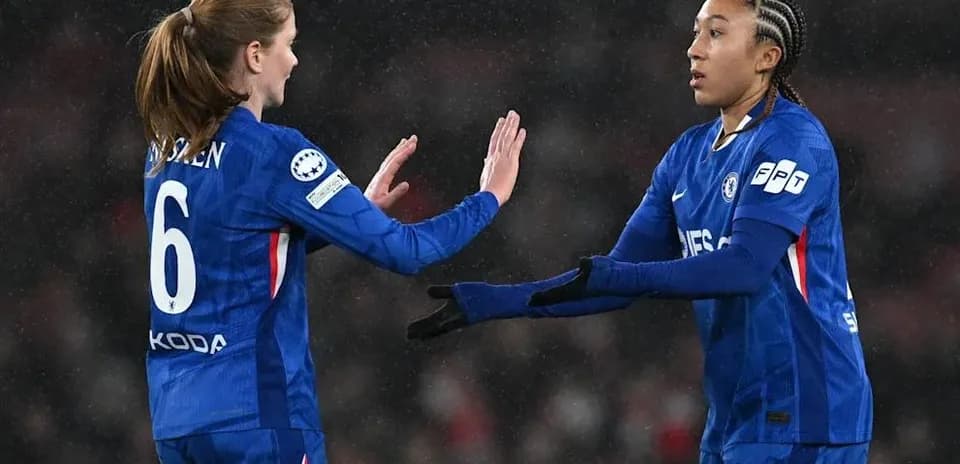Two Chelsea players exchanging gestures on the pitch