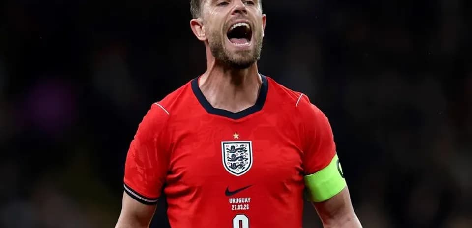 Player celebrating in England's red jersey with captain's armband