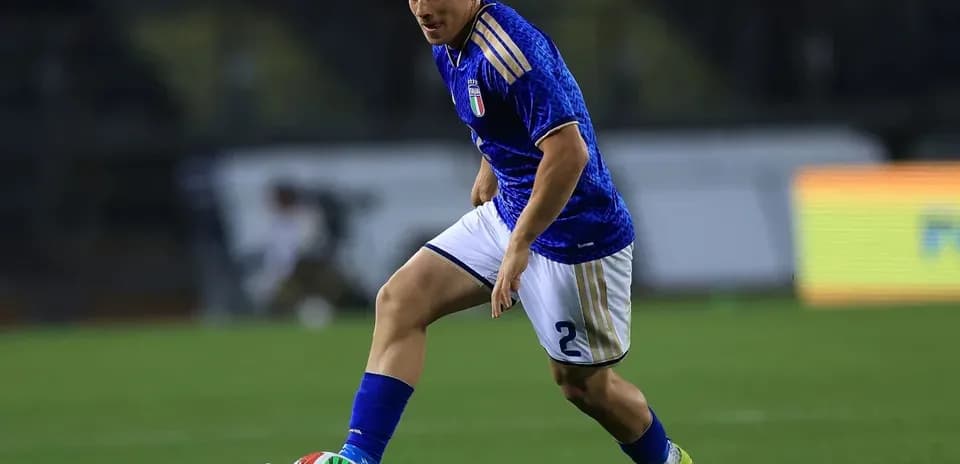 Player dribbling the ball during a football match