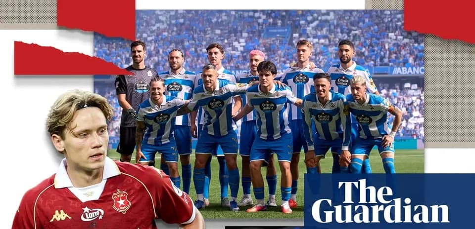 Football team posing for group photo on pitch