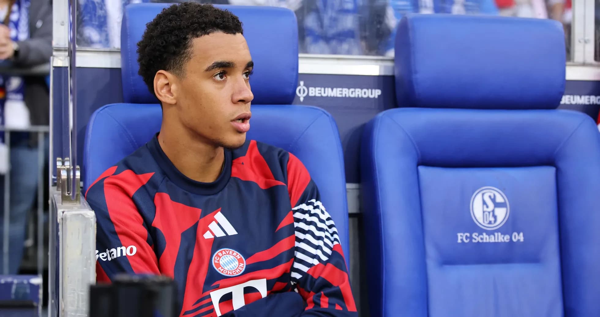Player sitting on bench during match at stadium