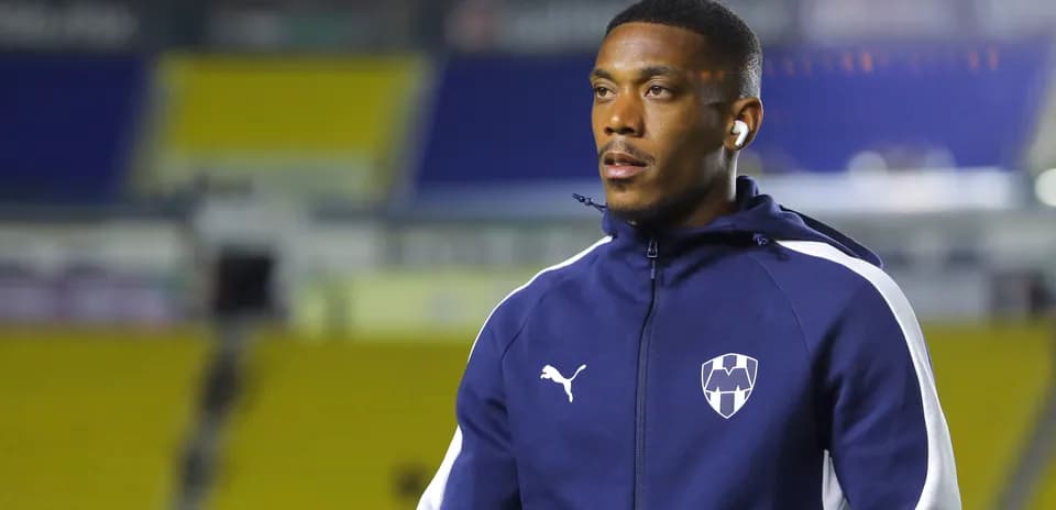 Player in Puma training jacket at stadium