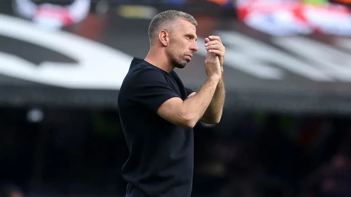 Coach gesturing during a match from the sidelines