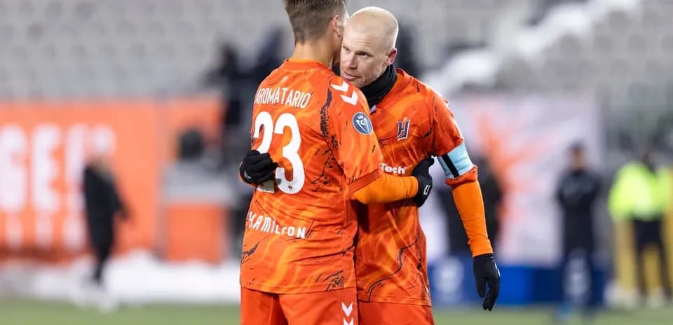Two players embracing after a match