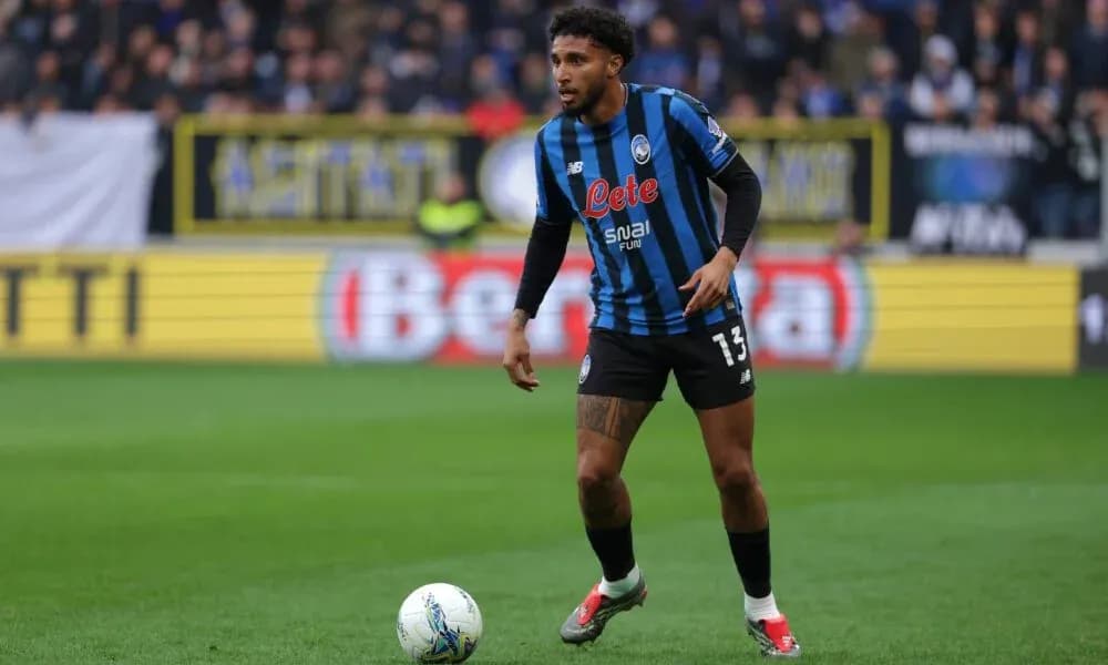 Player in Atalanta kit preparing for action on field