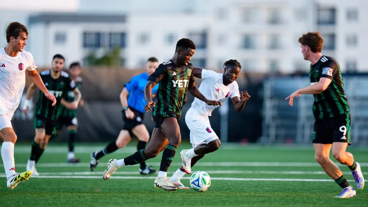 Players competing for the ball in MLS Next Pro match